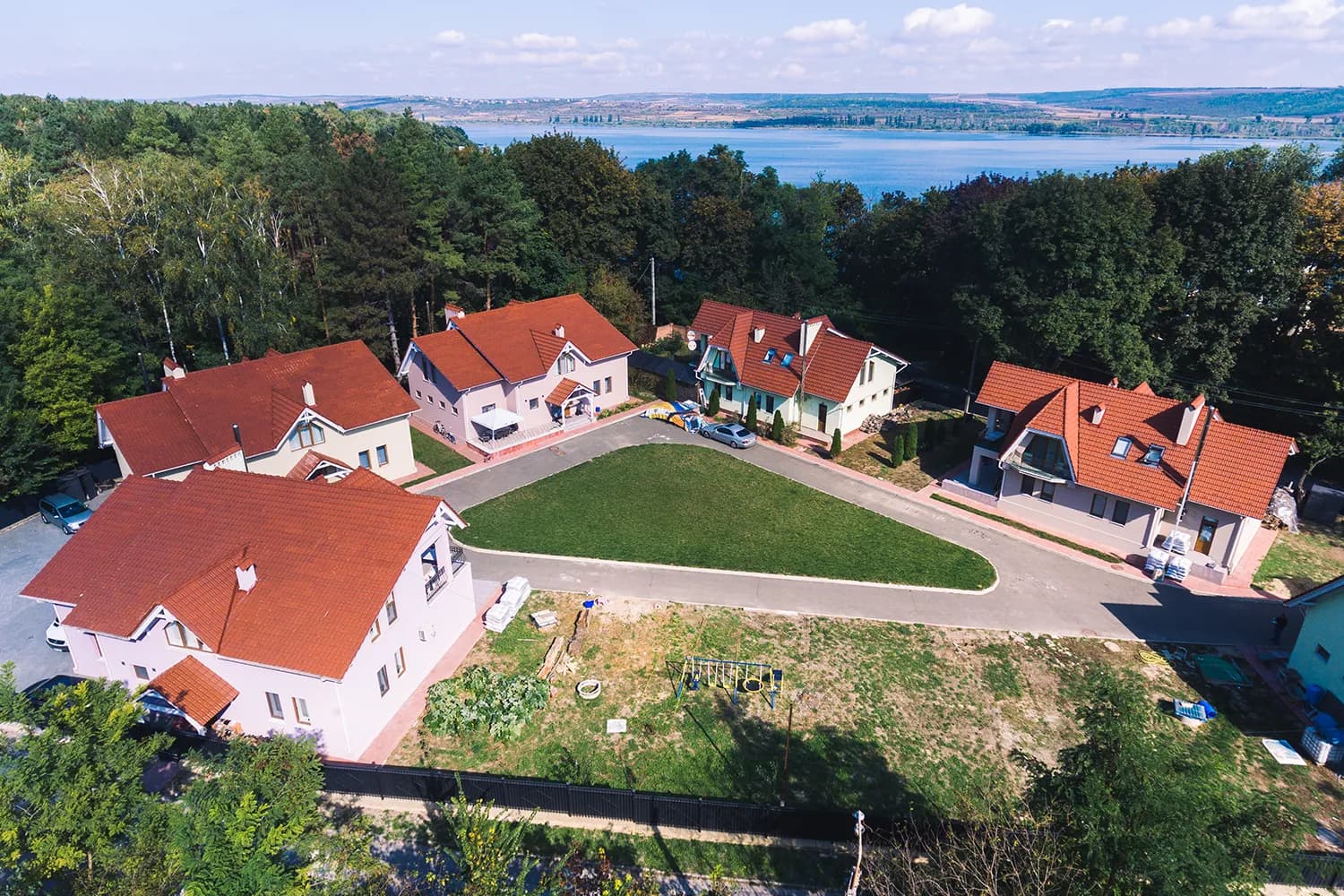 Aerial view of Vatra Village beside the lake